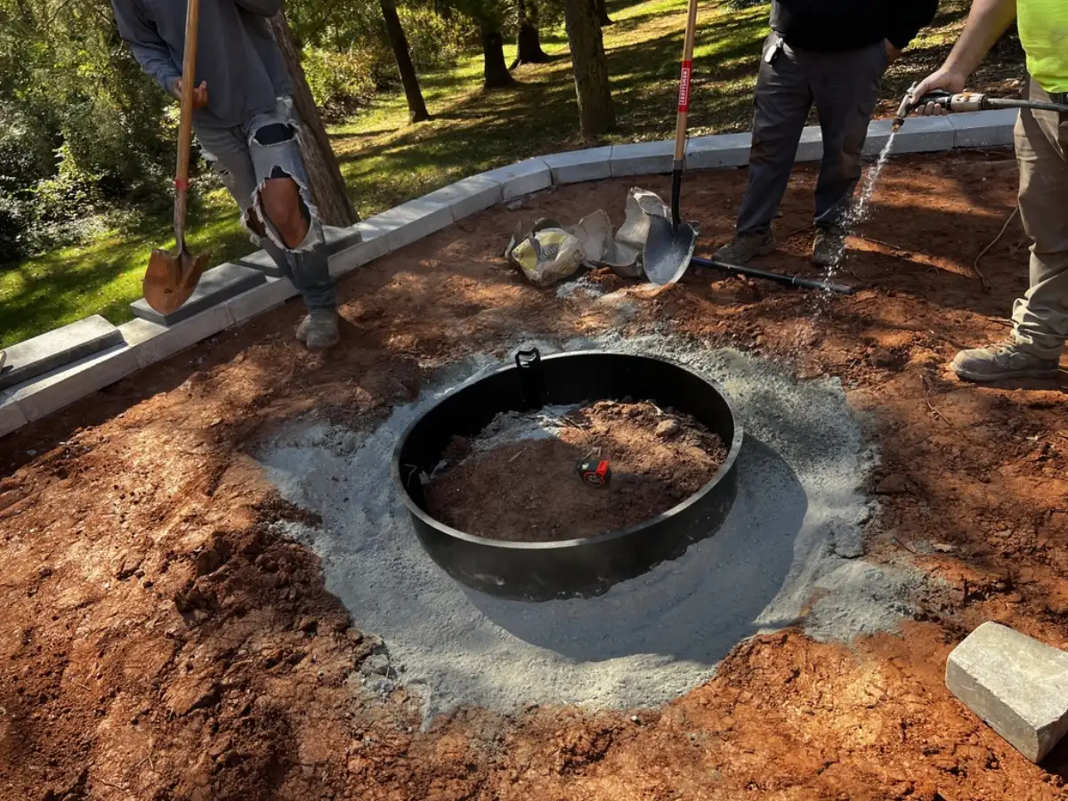 Firepit installation in progress by Webber Landscaping